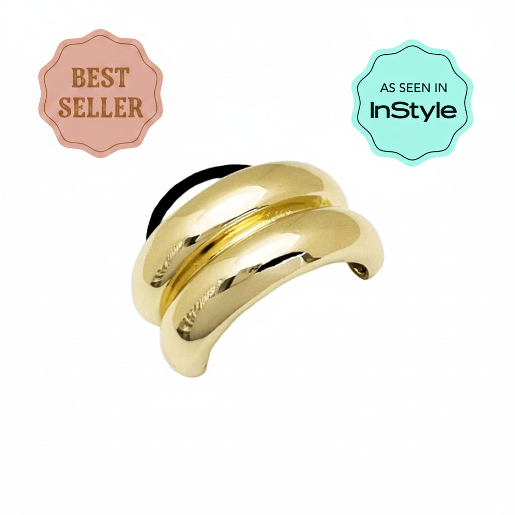 Gold hair tie on a white background with 'InStyle' logo.